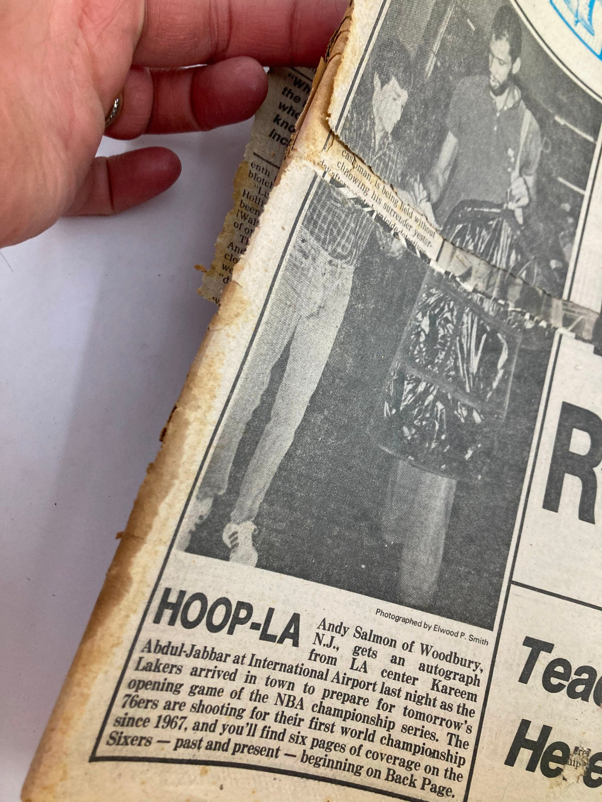 Close-up of the 1982 Philadelphia Daily News Tabloid 'Hoop-La Andy Salmon of Woodbury', highlighting wear and tear on the newspaper.