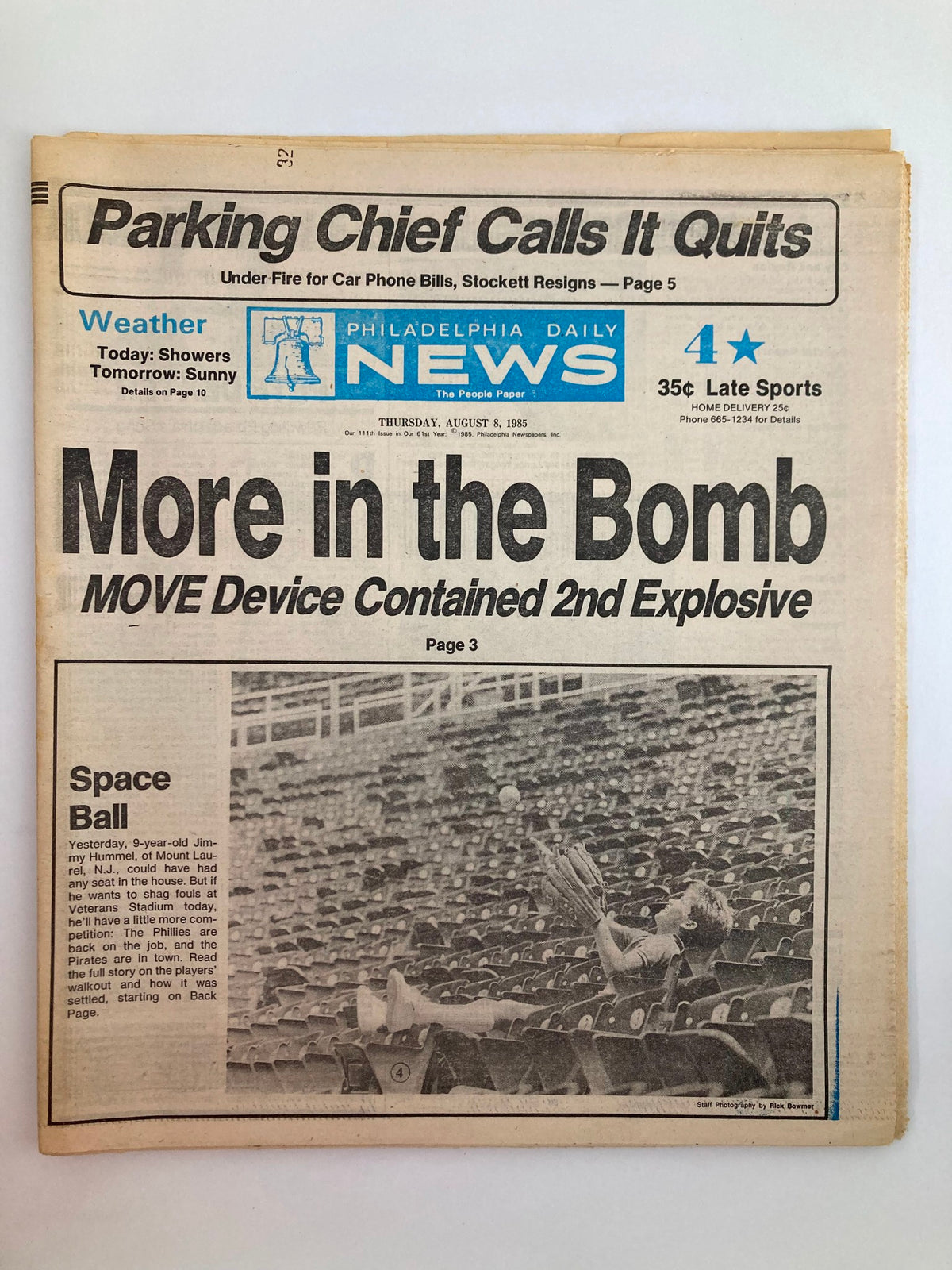 Philadelphia Daily News Tabloid from August 8, 1985 featuring the headline 'Space Ball' along with news about the MOVE device and the bomb. The newspaper shows notable wear and comes with a protective covering.