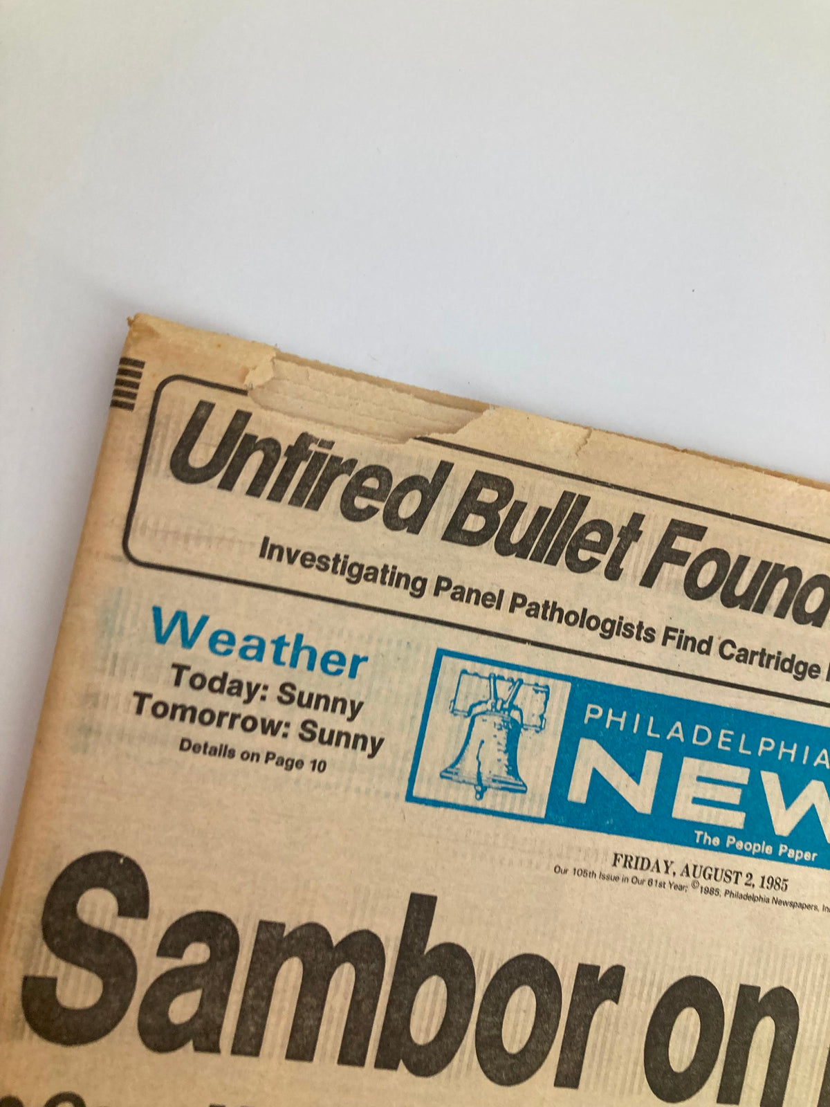 Close-up of the Philadelphia Daily News Tabloid dated August 2, 1985, highlighting the headline 'Unfired Bullet Found in MOVE Body' and the weather report. This edition features key community news and investigative journalism.