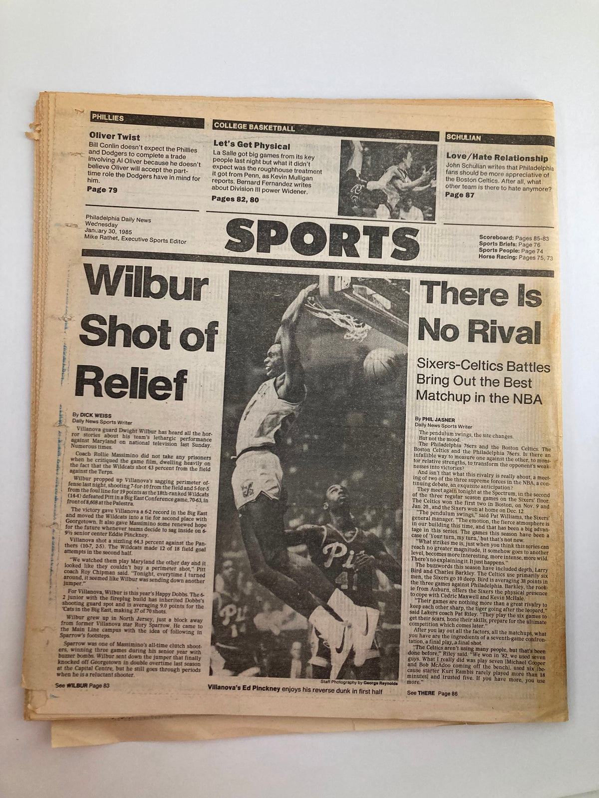 Philadelphia Daily News Tabloid January 30 1985, highlighting a sports column with basketball coverage, including a player dunking and commentary on a Philadelphia Sixers vs. Boston Celtics matchup.