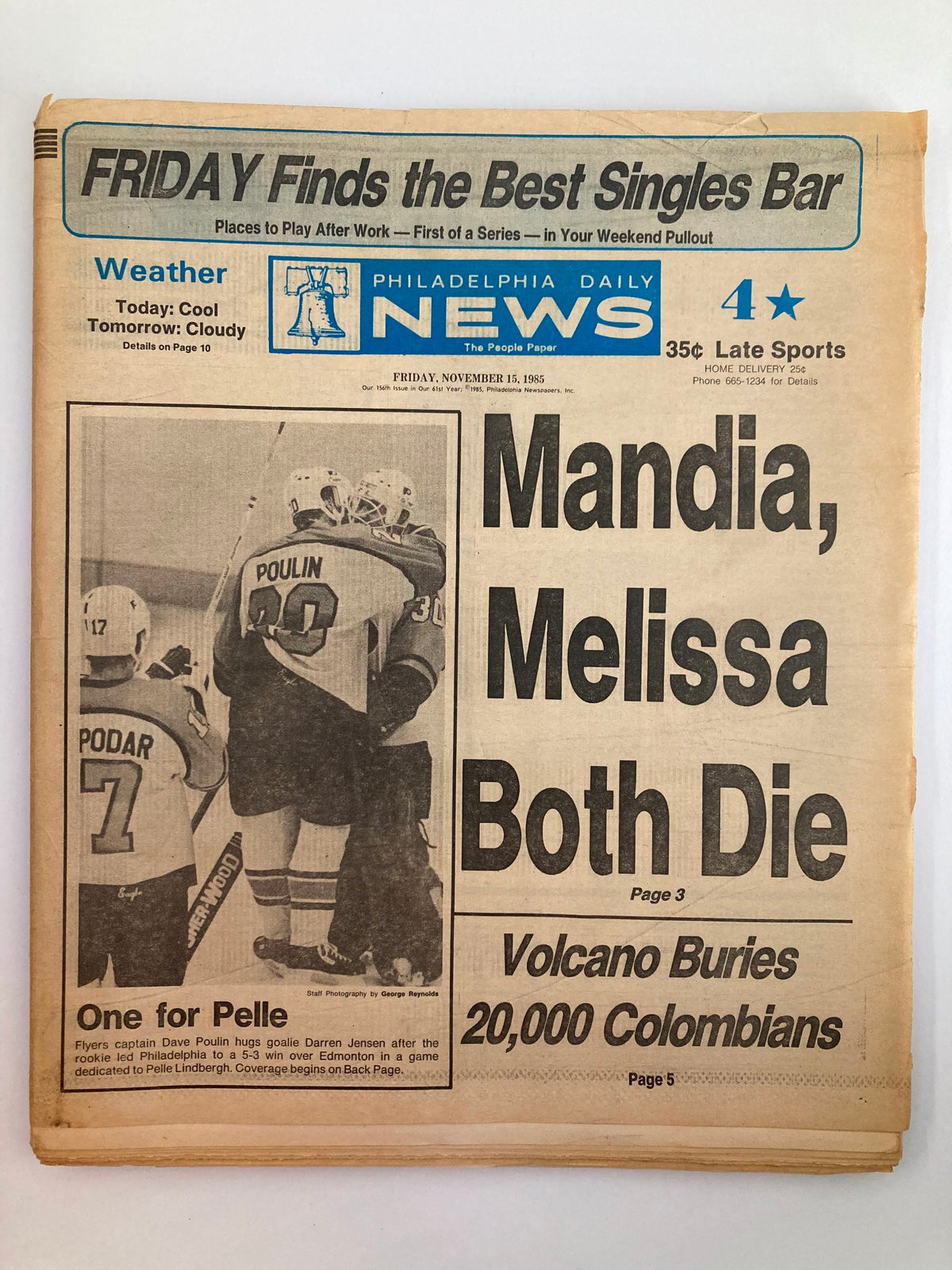Philadelphia Daily News tabloid from November 15, 1985, featuring NHL Flyers player Dave Poulin on the cover. The newspaper highlights sports news and events.