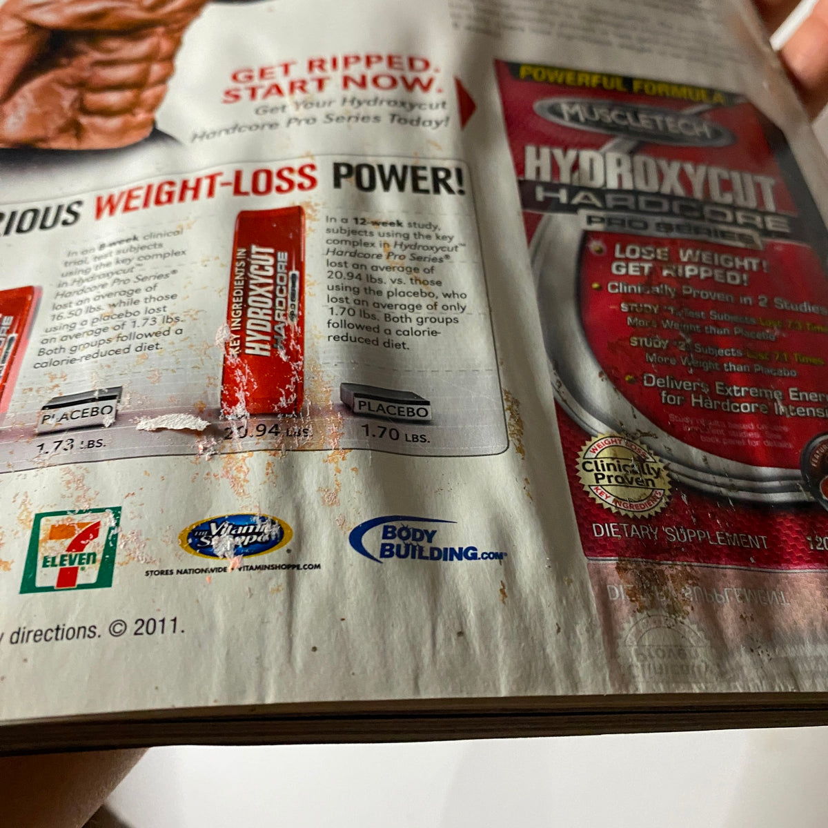 Interior page of MuscleMag Magazine December 2011 displaying an advertisement for Hydroxycut with weight-loss power details.