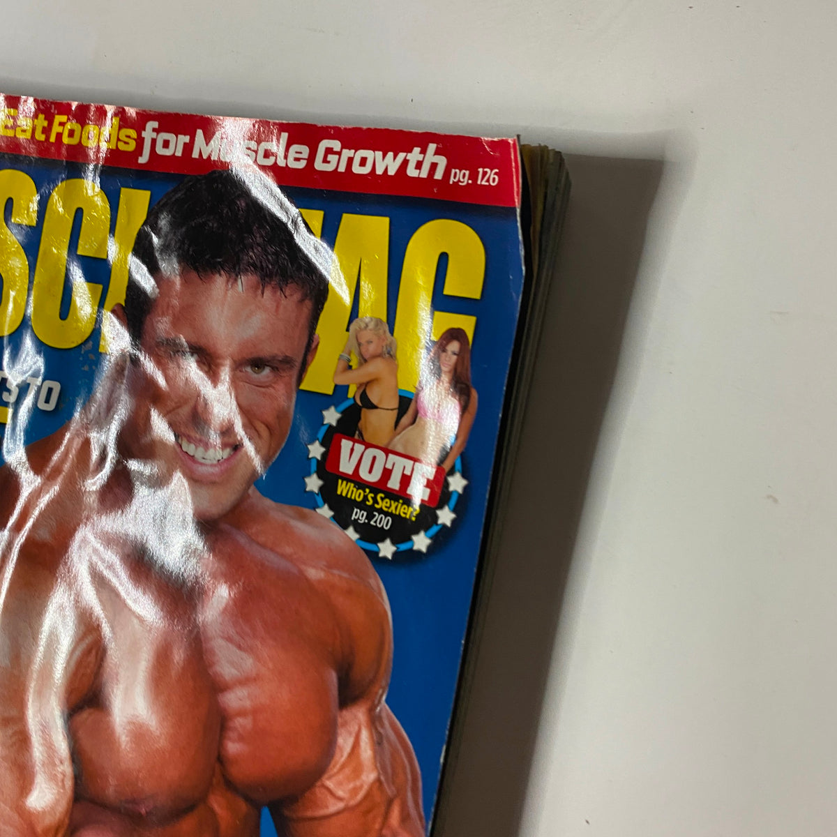 Close-up of the MuscleMag Magazine May 2012 cover highlighting Blair Mone, with visible wear, emphasizing its vintage condition.