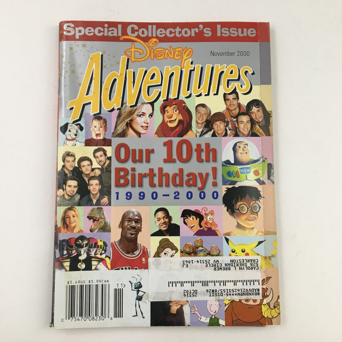 Cover of Disney Adventures Magazine from November 2000, featuring Michael Jordan and Britney Spears, celebrating its 10th birthday with colorful illustrations of various Disney characters and celebrities.