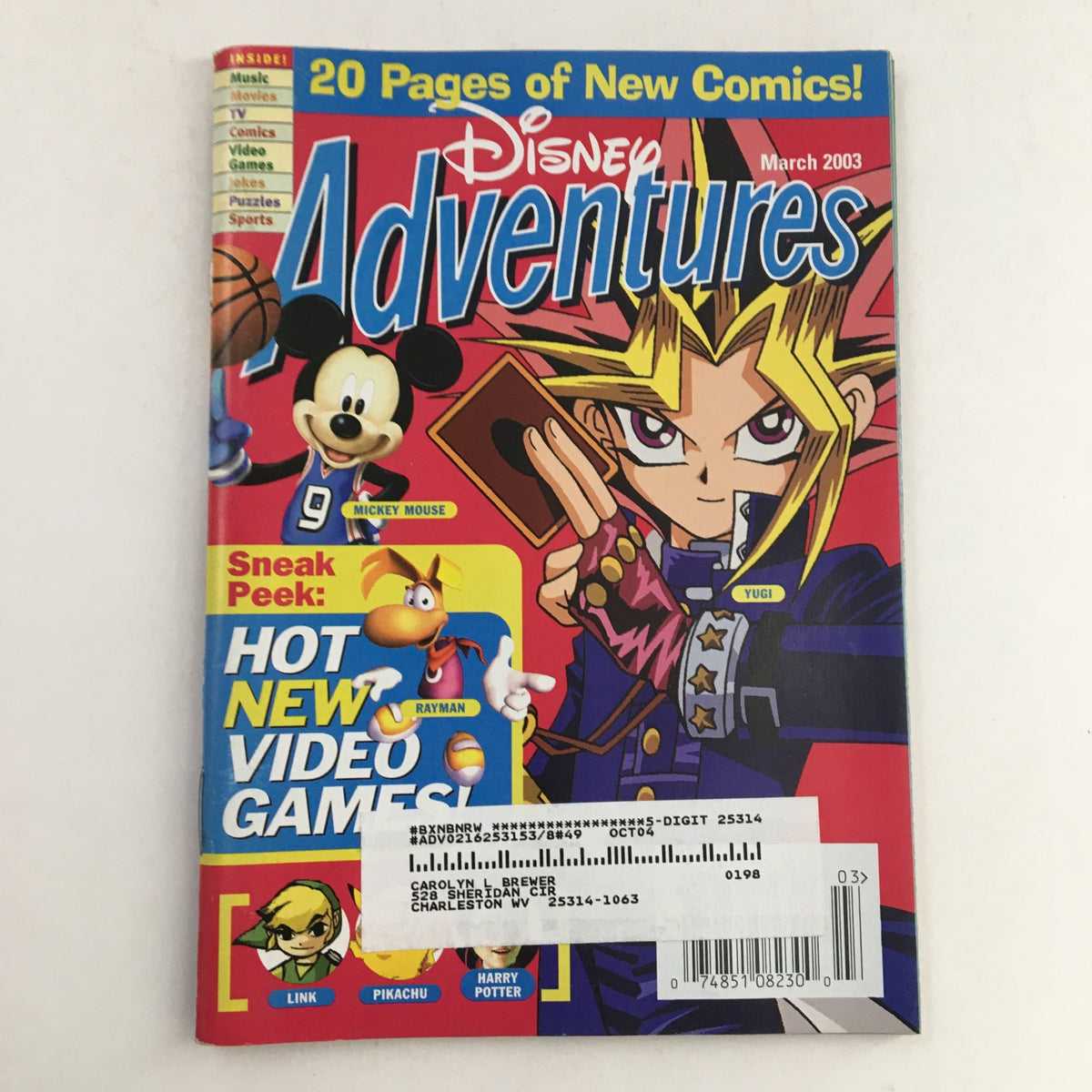 Cover of Disney Adventures Magazine March 2003 featuring Mickey Mouse, Yugi from Yu-Gi-Oh, and video game references. Includes colorful illustrations and promotional text about new comics and games.