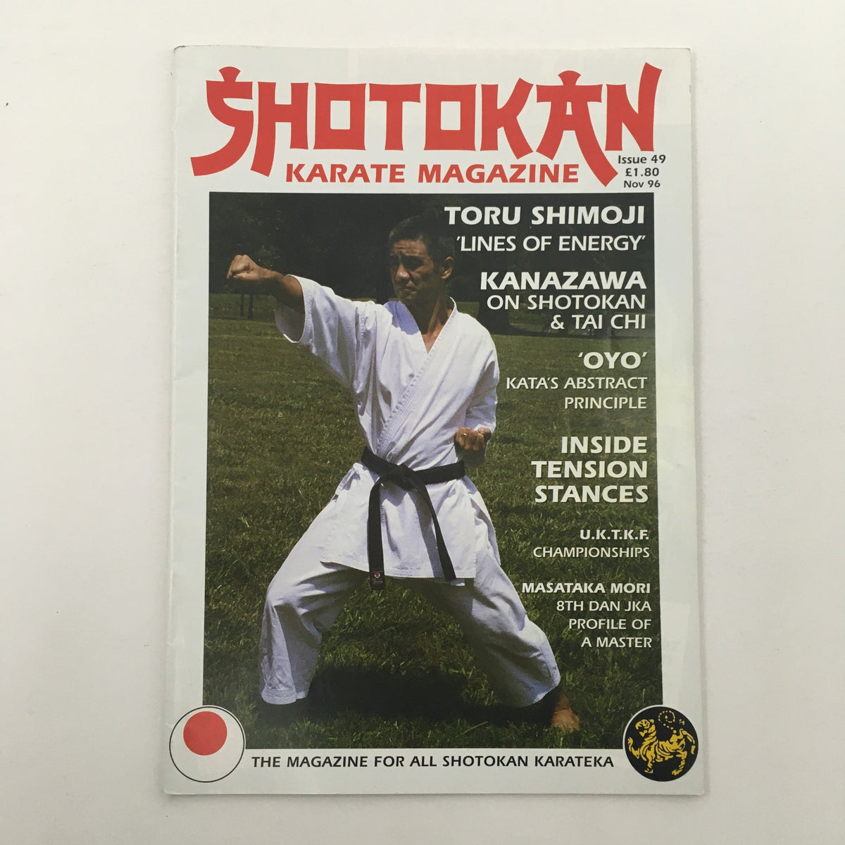 Shotokan Karate Magazine November 1996 Issue 49 featuring striking imagery of a karate practitioner demonstrating a stance, with headlines on martial arts topics such as 'Lines of Energy', 'OYO Kata's Abstract Principle', and more.