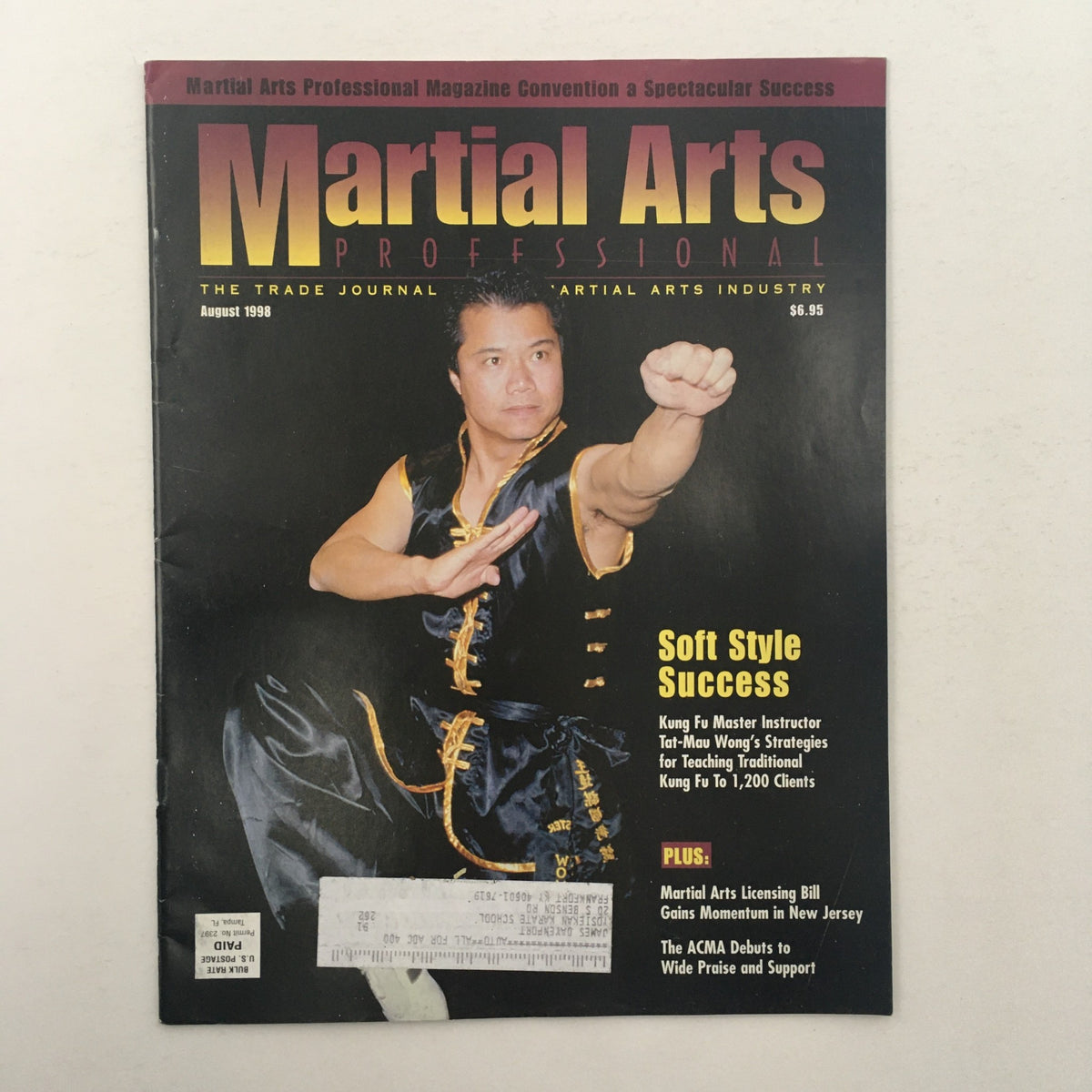 Martial Arts Professional Magazine August 1998 featuring Kung Fu Instructor Tat-Mau Wong. The cover showcases a dynamic image of Wong demonstrating a Kung Fu stance, accompanied by text highlighting strategies for teaching traditional Kung Fu.