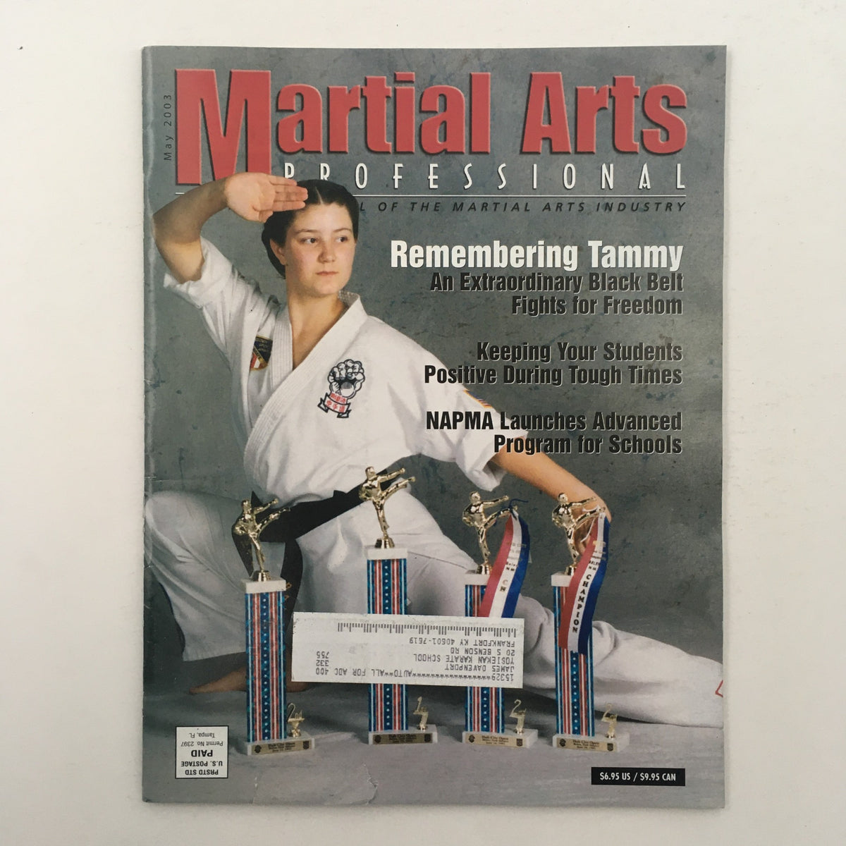 Cover of Martial Arts Professional Magazine May 2003 featuring a tribute to Tammy, showcasing martial arts themes and highlighting resilience in the sport.