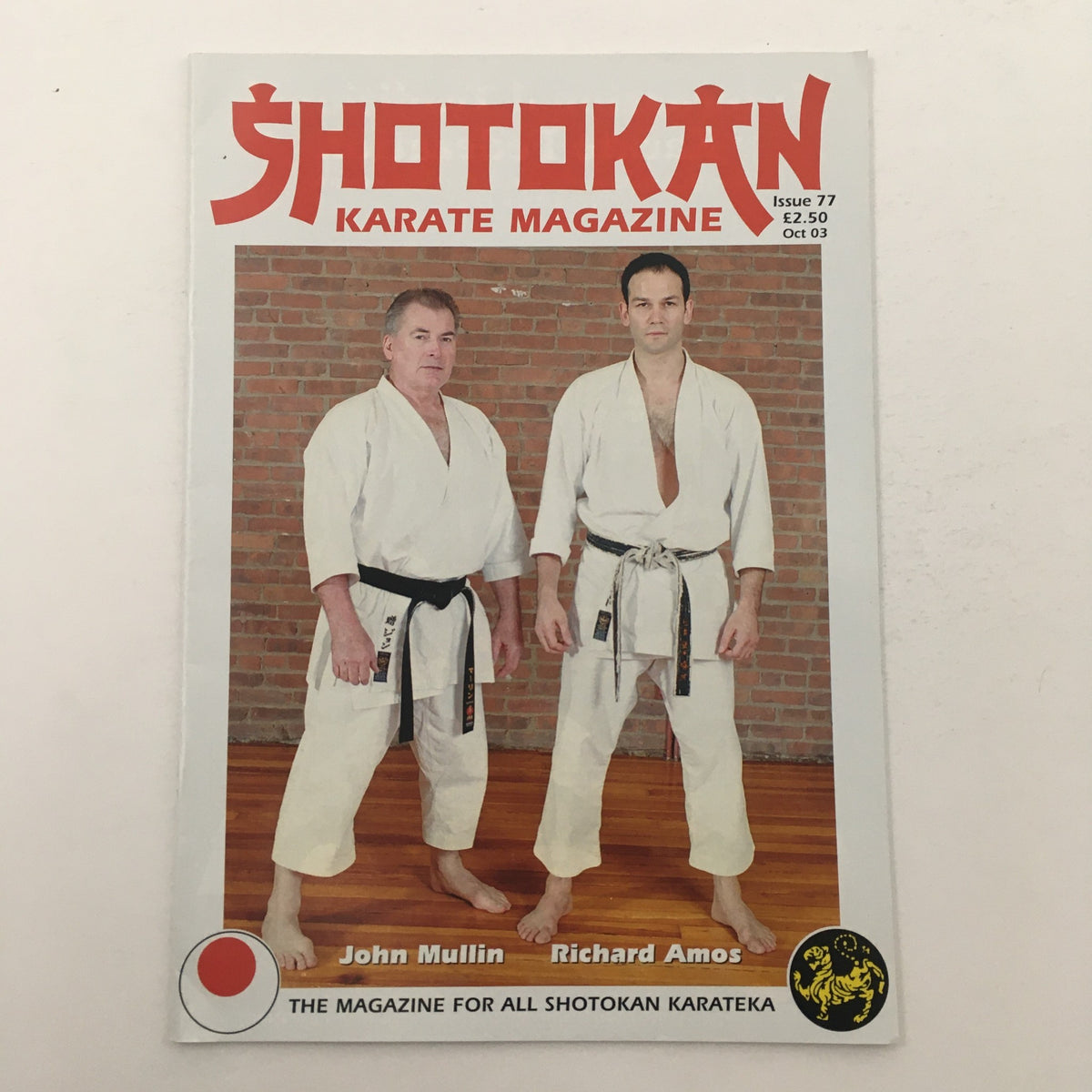 Cover of Shotokan Karate Magazine October 2003 featuring Senseis John Mullin and Richard Amos, highlighting martial arts themes and karate culture.