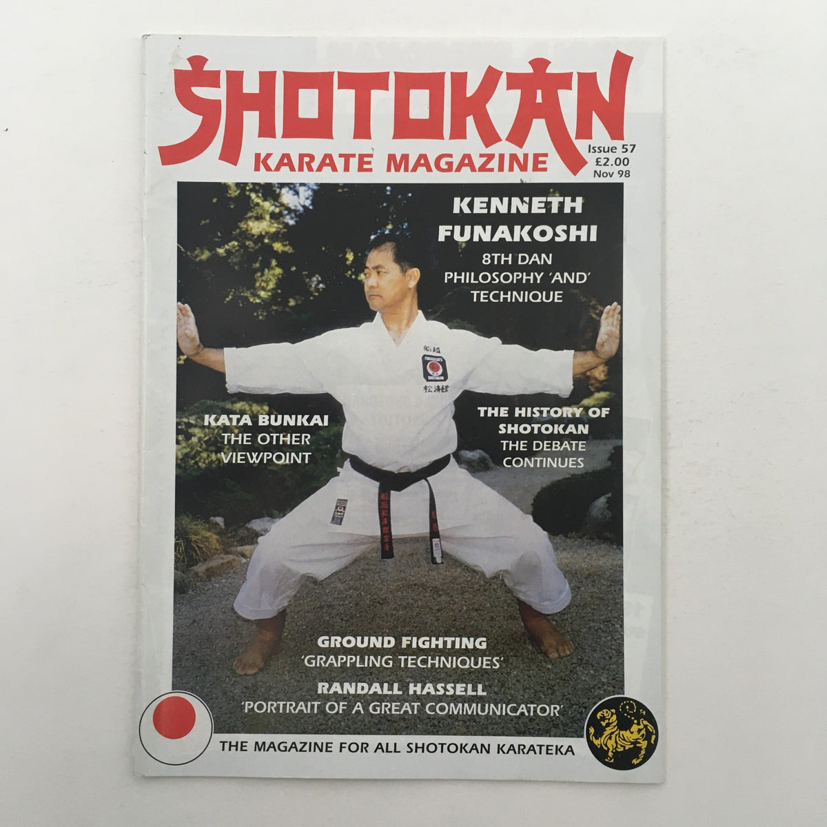 Cover of Shotokan Karate Magazine November 1998 Issue 57 featuring Shihan Kenneth Funakoshi showcasing karate stance and articles on karate philosophy and techniques.