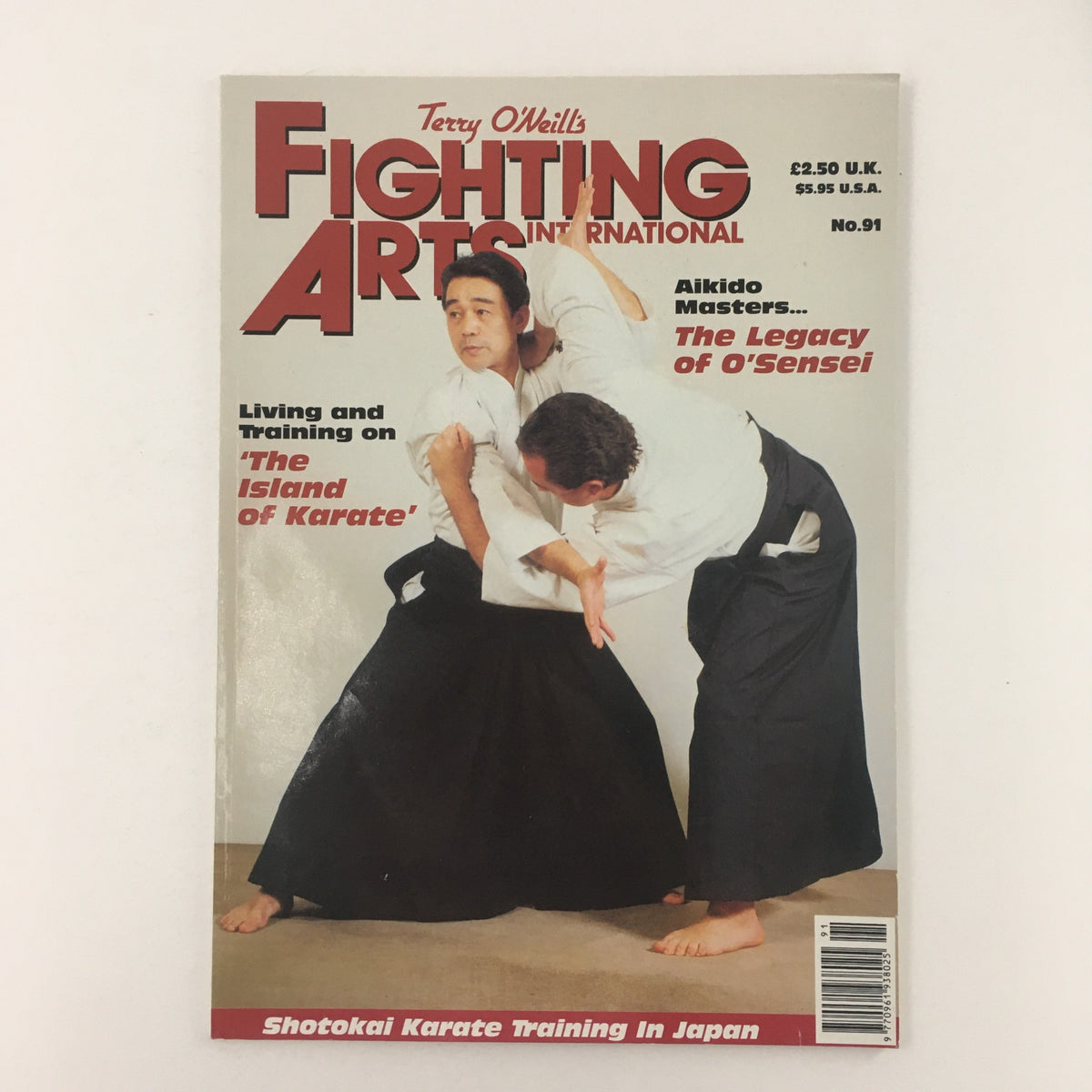 Cover of Fighting Arts International Magazine No. 91, titled 'The Legacy of O'Sensei', featuring a martial arts demonstration with practitioners in traditional attire. The magazine explores the significance of O'Sensei in martial arts history.