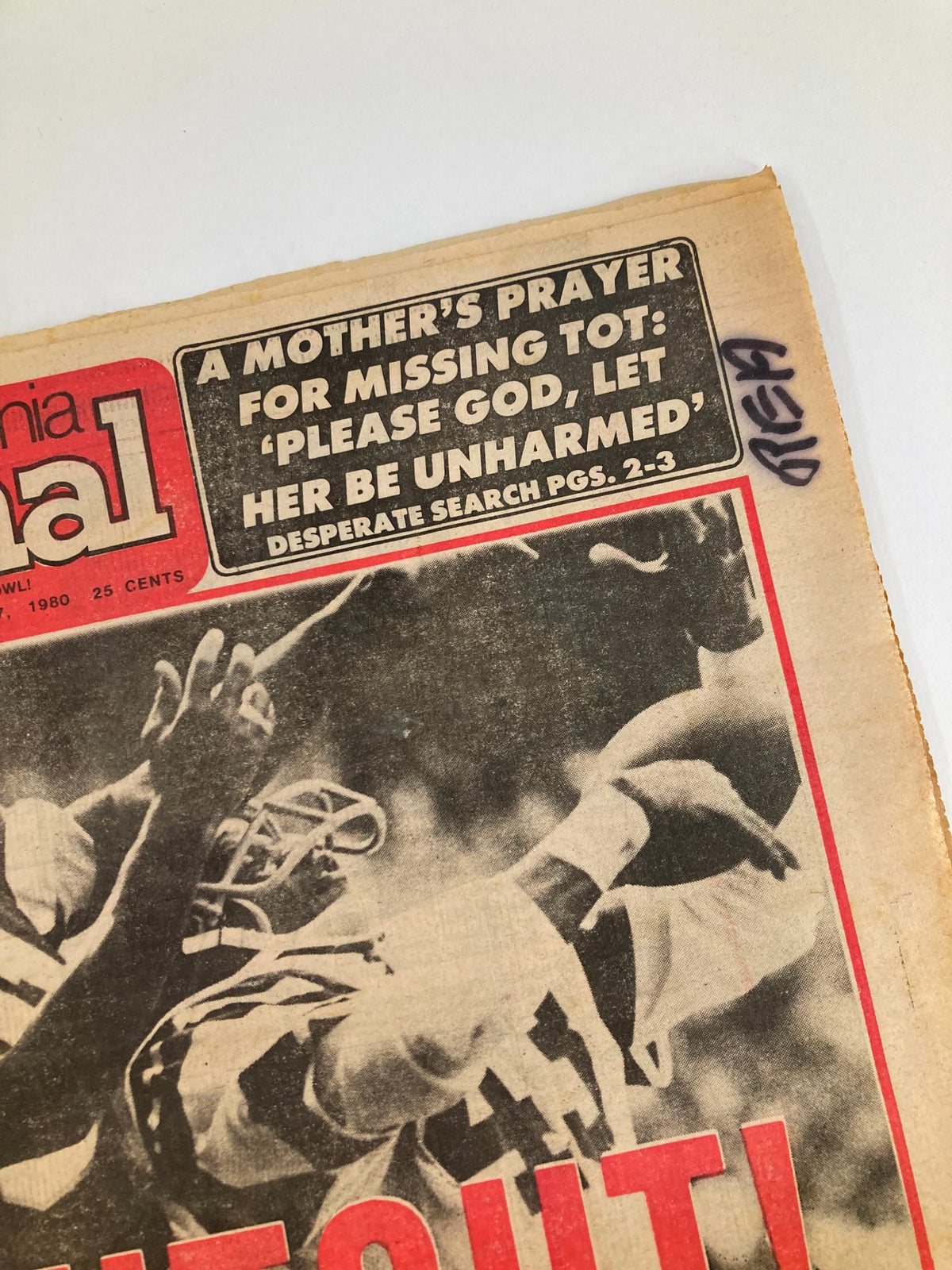 Close-up view of the headline from the Philadelphia Journal Tabloid November 17, 1980, highlighting a plea for a missing child alongside sports news about the Philadelphia Eagles.