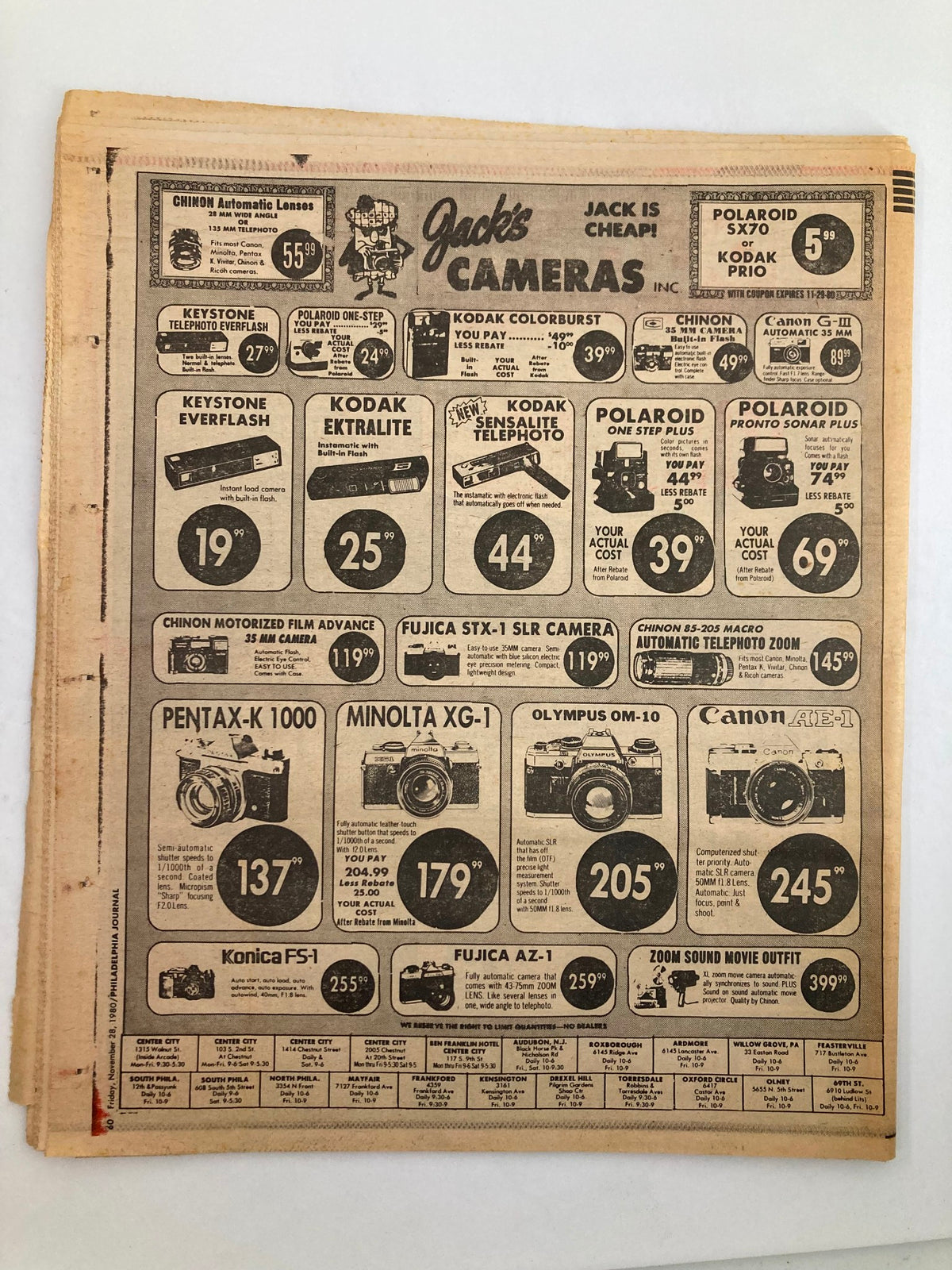 Back cover of the Philadelphia Journal Tabloid November 28 1980 displaying advertisements for cameras, including brands like Pentax, Minolta, and Canon.