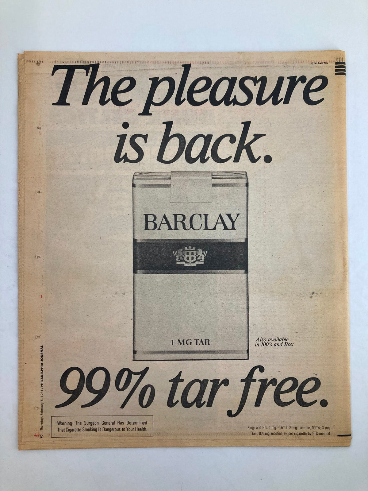 Philadelphia Journal Tabloid advertisement highlighting Barclay cigarettes, emphasizing 'The pleasure is back' and stating '99% tar free.' This ad illustrates 1980s marketing for tobacco products.