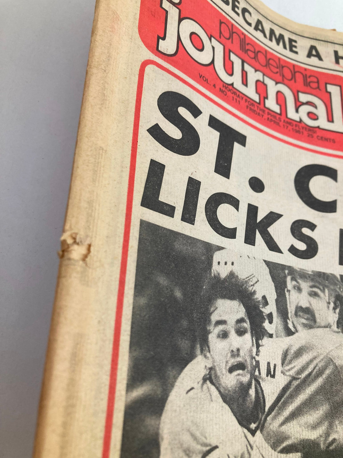 Close-up view of the Philadelphia Journal Tabloid April 17, 1981, Vol 4 #111 showing minor wear on the edge with the headline 'St. Croix Licks Flames'.