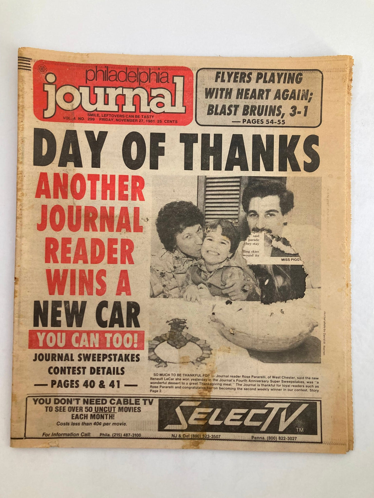 Philadelphia Journal Tabloid from November 27, 1981, showcasing the headline "FLYERS BLAST BRUINS, 3-1." The front page features a family smiling together with a Thanksgiving theme and contest details.
