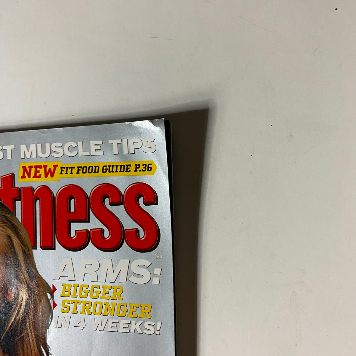 Men's Fitness Magazine October 2006 cover featuring bold red text and focus on fitness tips for bigger arms and nutrition highlights.