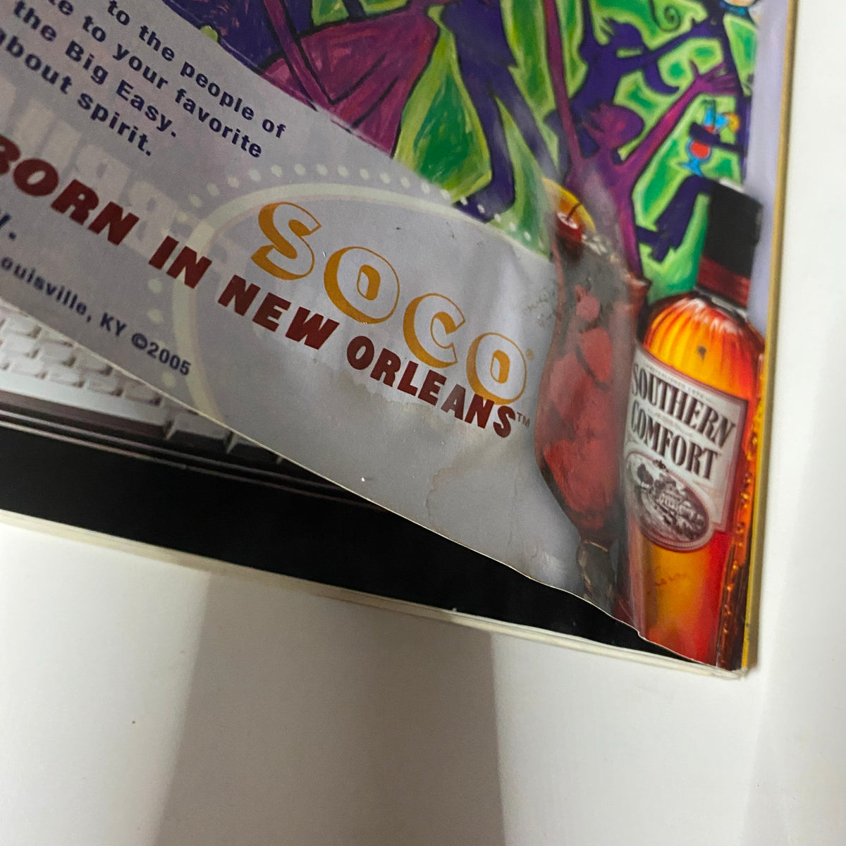 Close-up of the Southern Comfort advertisement from Stuff Magazine February 2006, featuring text 'BORN IN NEW ORLEANS' to highlight the product origin.