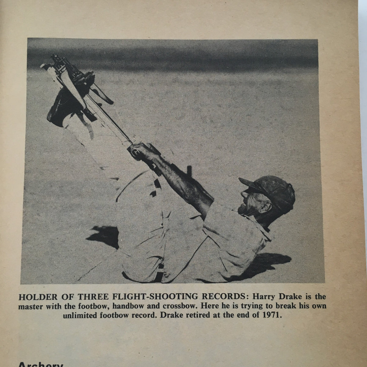 Image of Harry Drake attempting to break a record in footbow from the Guinness Sports Record Book 1972 by Norris and Ross McWhirter.