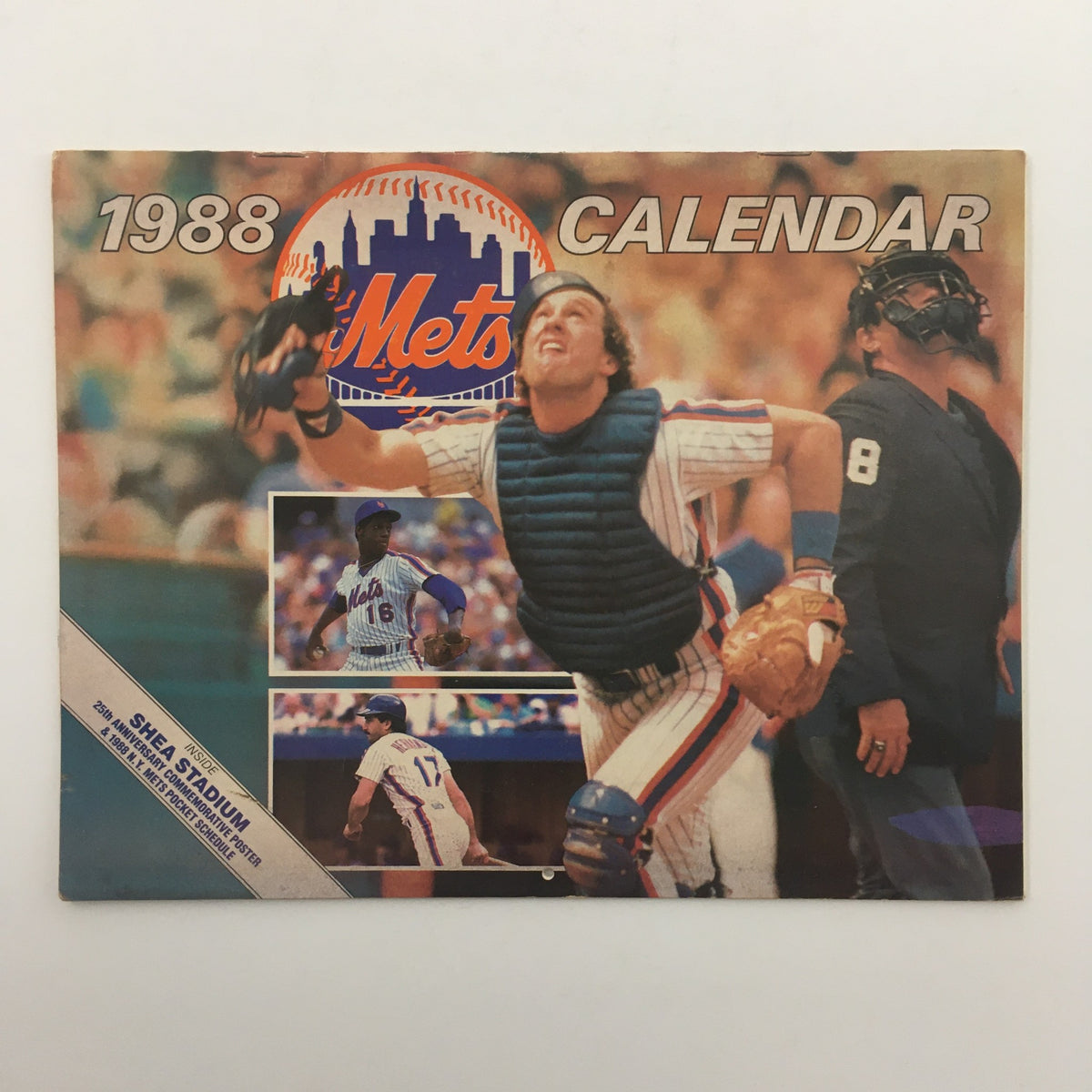 1988 New York Mets Calendar cover featuring a player in a catcher's gear, excitedly capturing a baseball, showcasing the Mets logo and Shea Stadium.