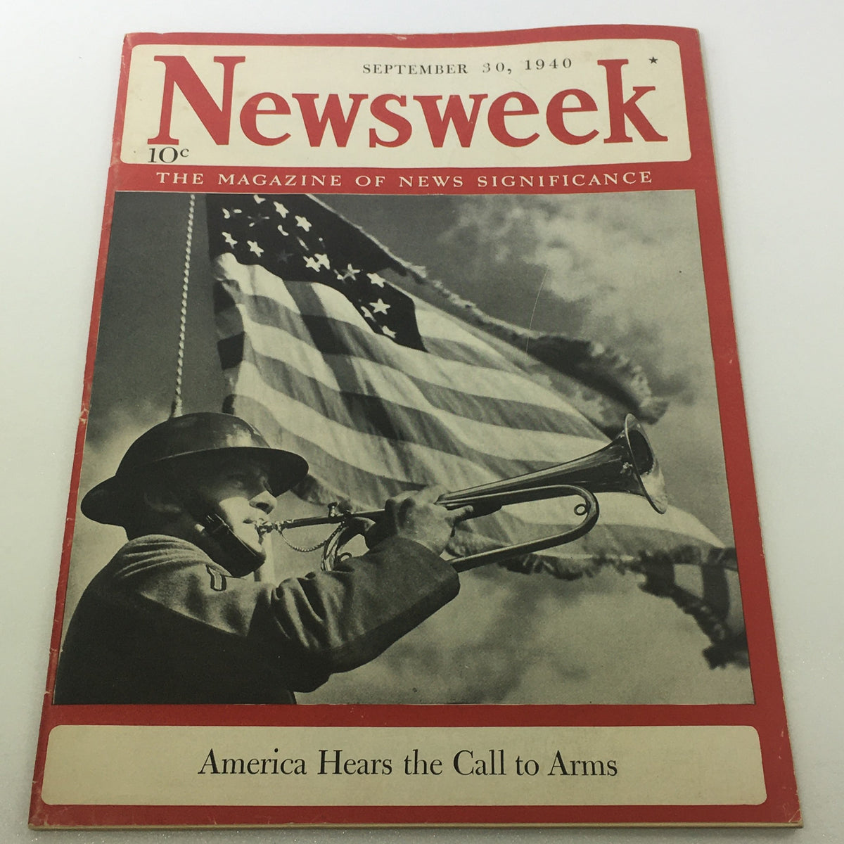 VTG Newsweek Magazine cover from September 30, 1940, featuring the title 'America Hears the Call To Arms,' showcasing a soldier playing a trumpet in front of an American flag.