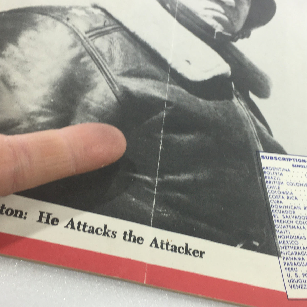 Close-up of the cover of VTG Newsweek Magazine: January 8, 1945 featuring the headline 'Patton: He Attacks the Attacker'. The image shows a finger pointing at the bold headline on the magazine.