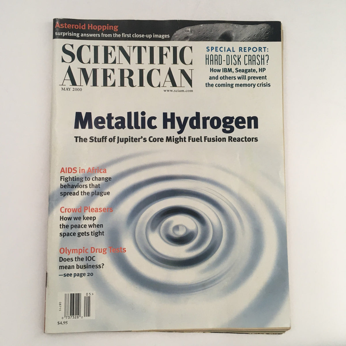 Cover of Scientific American Magazine, May 2000 edition featuring the title 'Metallic Hydrogen: The Stuff of Jupiter's Core Might Fuel Fusion Reactors'. The magazine includes highlights on AIDS in Africa, crowd pleasers, and Olympic drug testing.