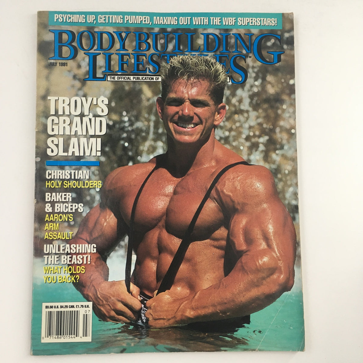 Cover of Bodybuilding Lifestyles Magazine July 1991 featuring Troy's Grand Slam, showcasing a muscular man posing in water. The magazine emphasizes various bodybuilding features and tips.