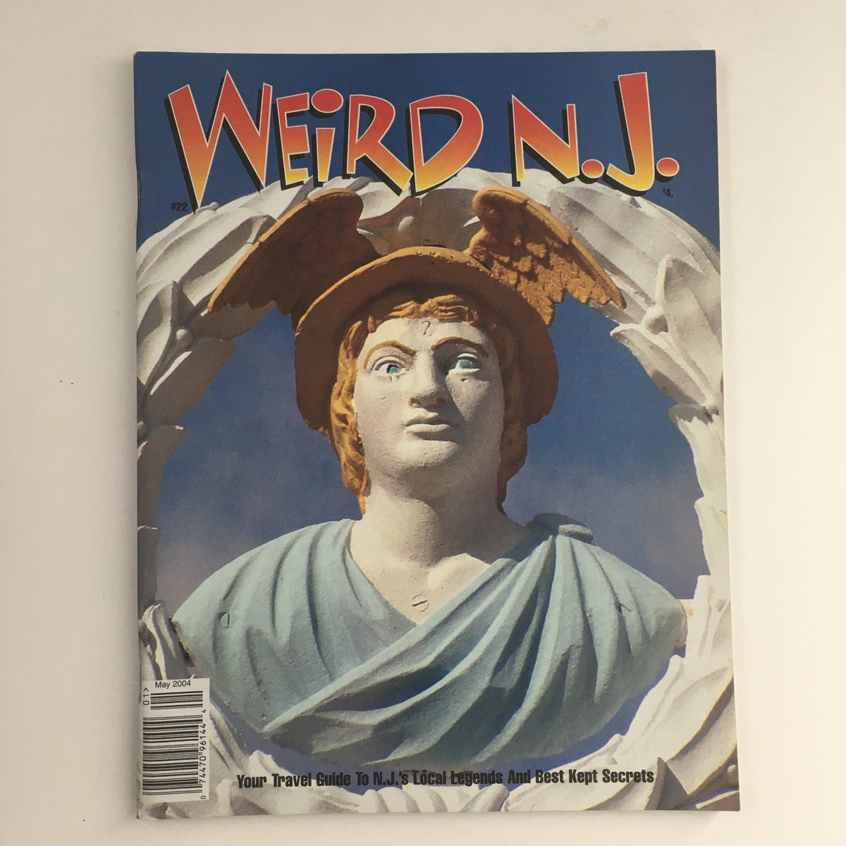 Cover of Weird N.J. Magazine May 2004 Issue #22, featuring a statue with angelic features, showcasing the title 'Your Travel Guide To N.J.'s Local Legends and Best Kept Secrets' alongside imagery representing New Jersey's quirky and mysterious culture.