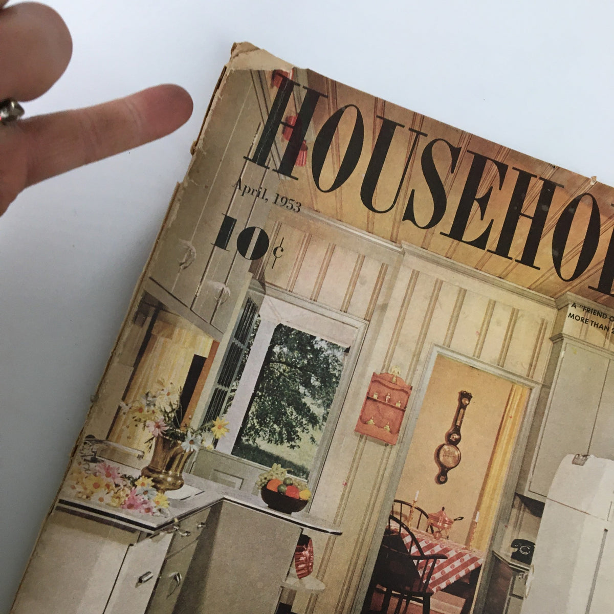 Close-up view of the cover of VTG Household Magazine April 1953 highlighting kitchen decor and the publication's nostalgic appeal.