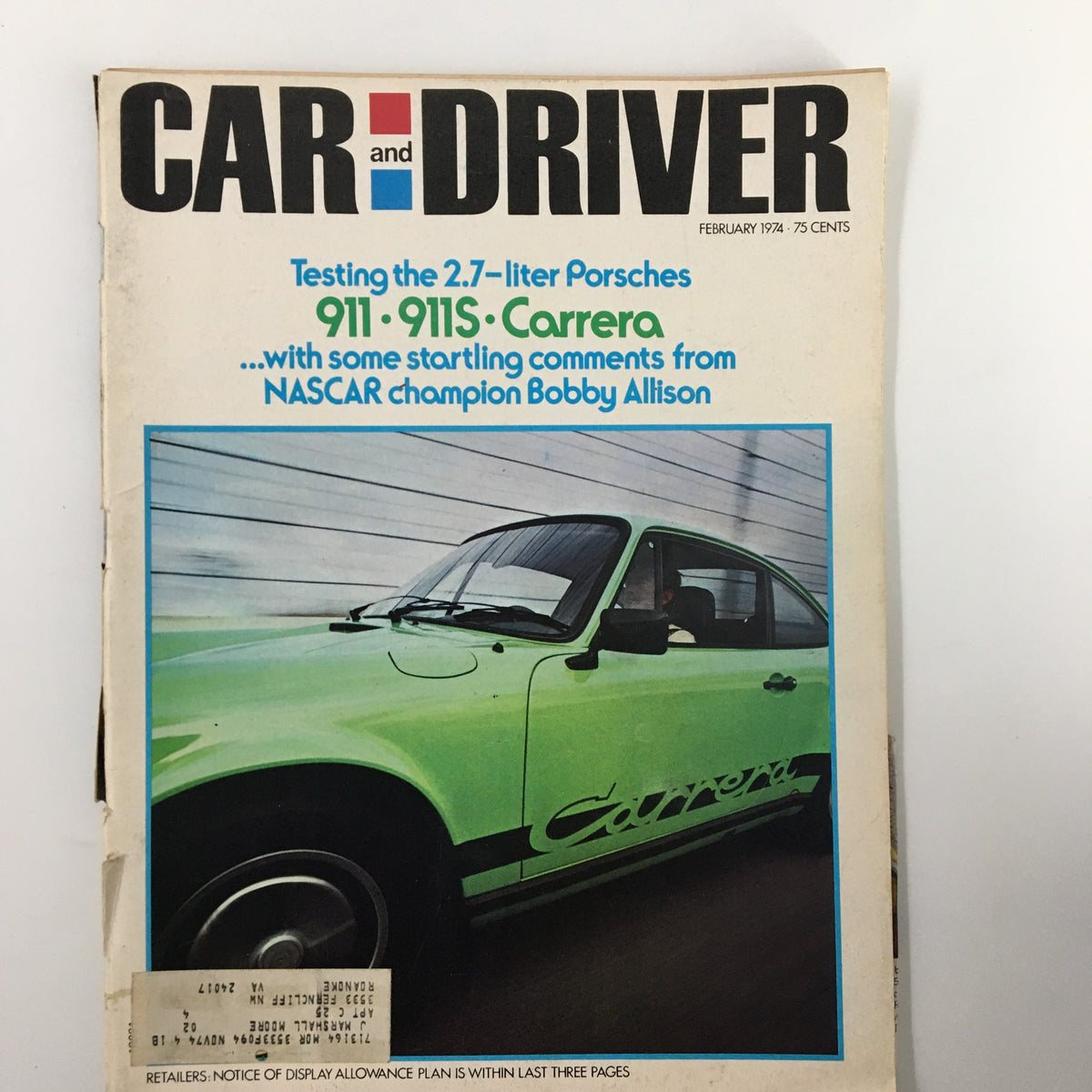 Cover of the February 1974 issue of Car and Driver magazine featuring Bobby Allison, showcasing a green Porsche 911 Carrera and promoting the article 'Testing the 2.7-liter Porsches'.