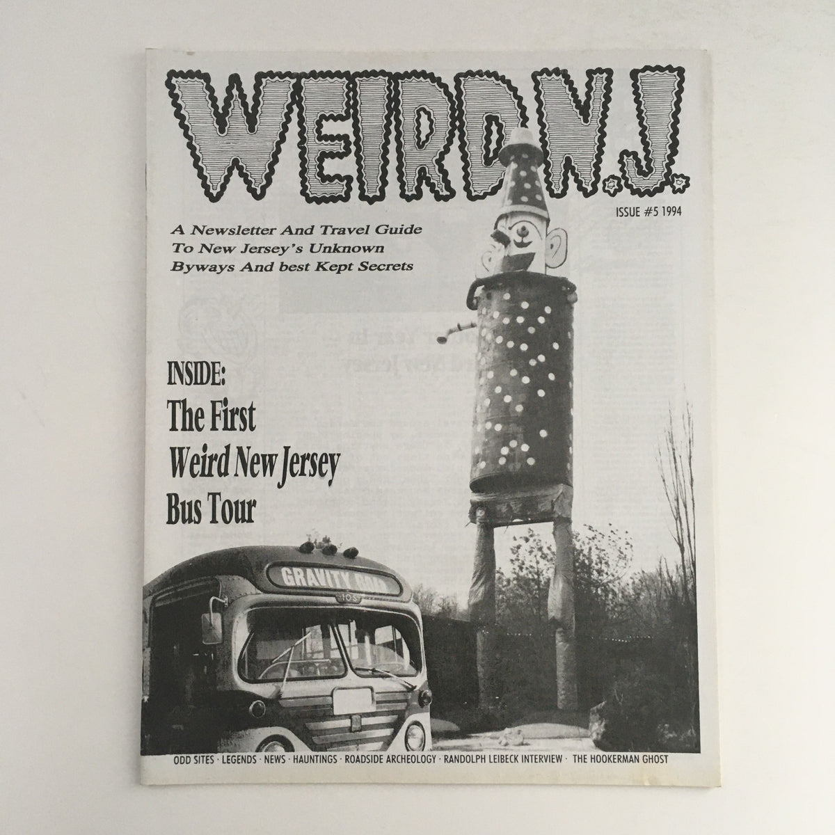 Cover of Weird N.J. Magazine 1994 #5, a travel guide to New Jersey's local legends. Features a vintage bus labeled 'Gravity Road' and a whimsical roadside attraction, emphasizing the quirky side of New Jersey.