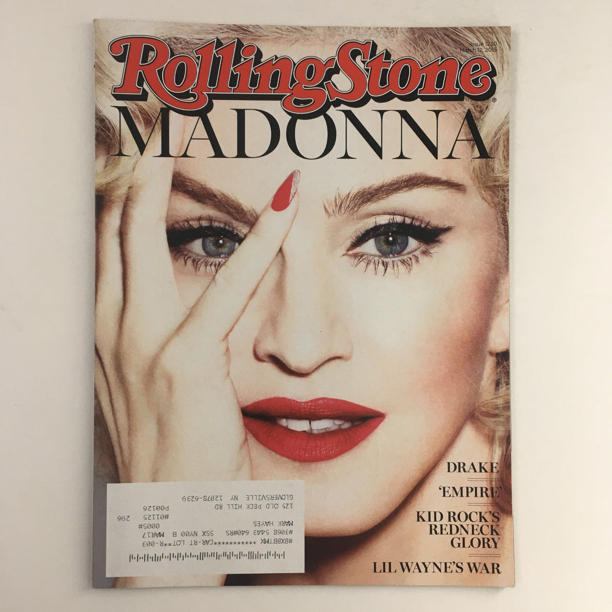 Rolling Stone Magazine cover from March 12, 2015 featuring Madonna, highlighting articles on Drake and Lil Wayne's War, ideal for music enthusiasts and collectors.