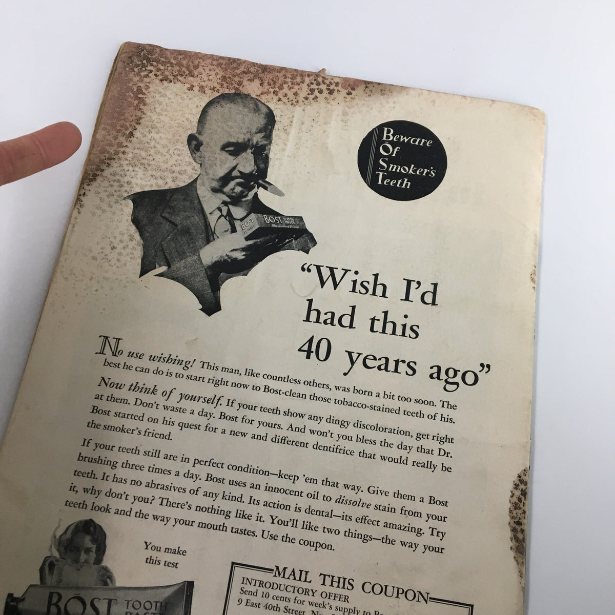 Back cover of the VTG NewsWeek Magazine July 8, 1933 featuring an advertisement for Bost Tooth Powder, emphasizing dental hygiene with a photograph of a man holding the product and text addressing the effects of smoking on teeth.