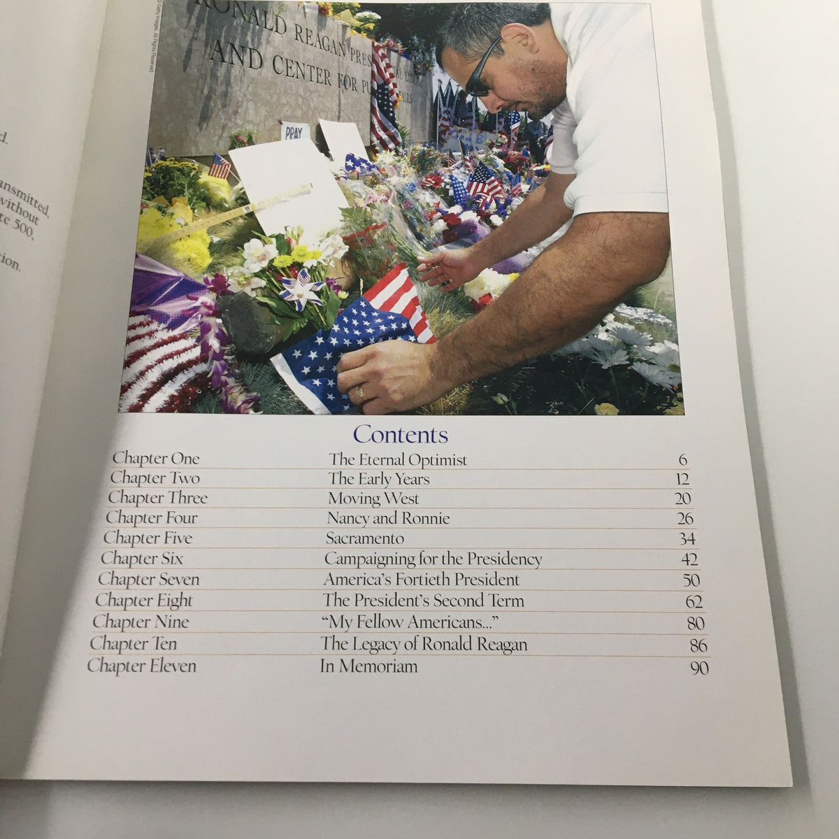 Table of contents page from 'A Tribute To Reagan 1911 - 2004', outlining chapters including 'The Eternal Optimist' and 'America's Fortieth President'.