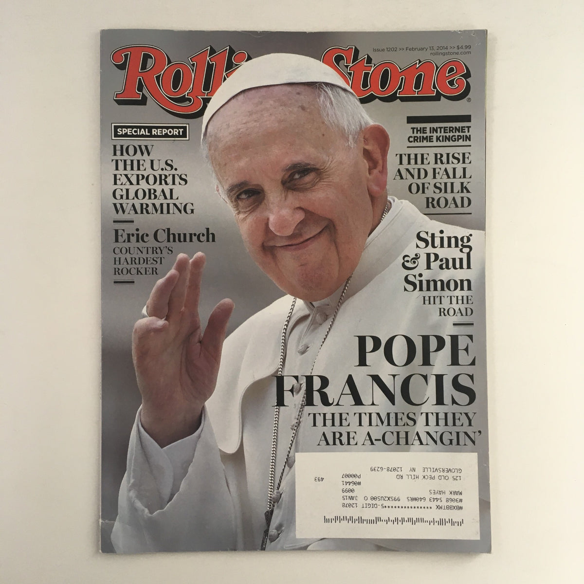 Rolling Stone Magazine cover from February 13, 2014 featuring Pope Francis, Eric Church, and Paul Simon, highlighting cultural themes and music history