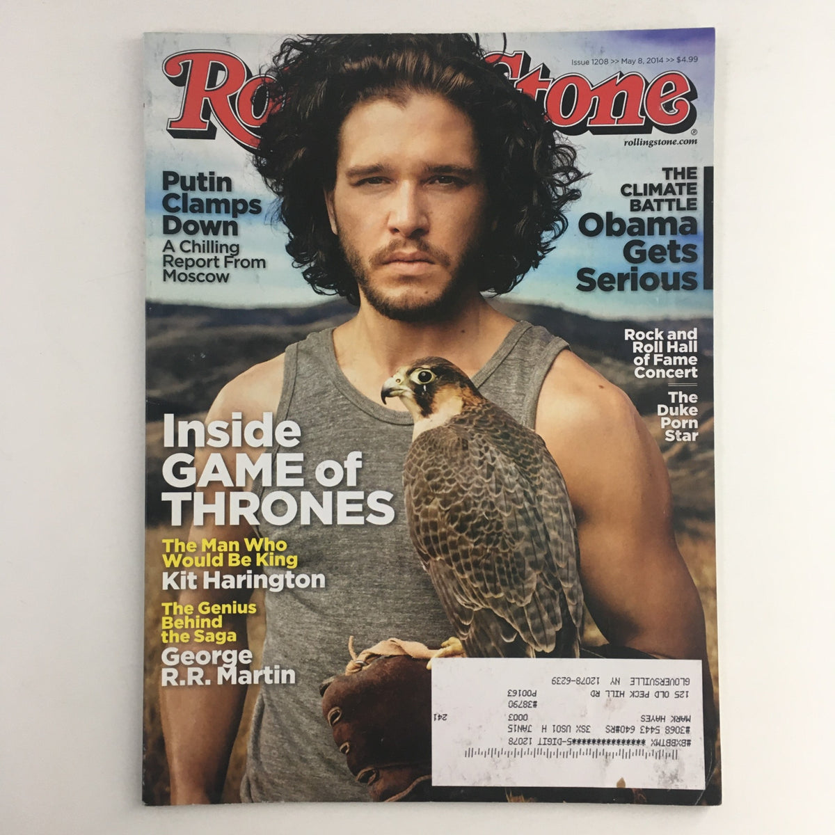Rolling Stone Magazine cover from May 8, 2014 featuring Kit Harington holding a falcon and George R.R. Martin, showcasing insights on Game of Thrones.