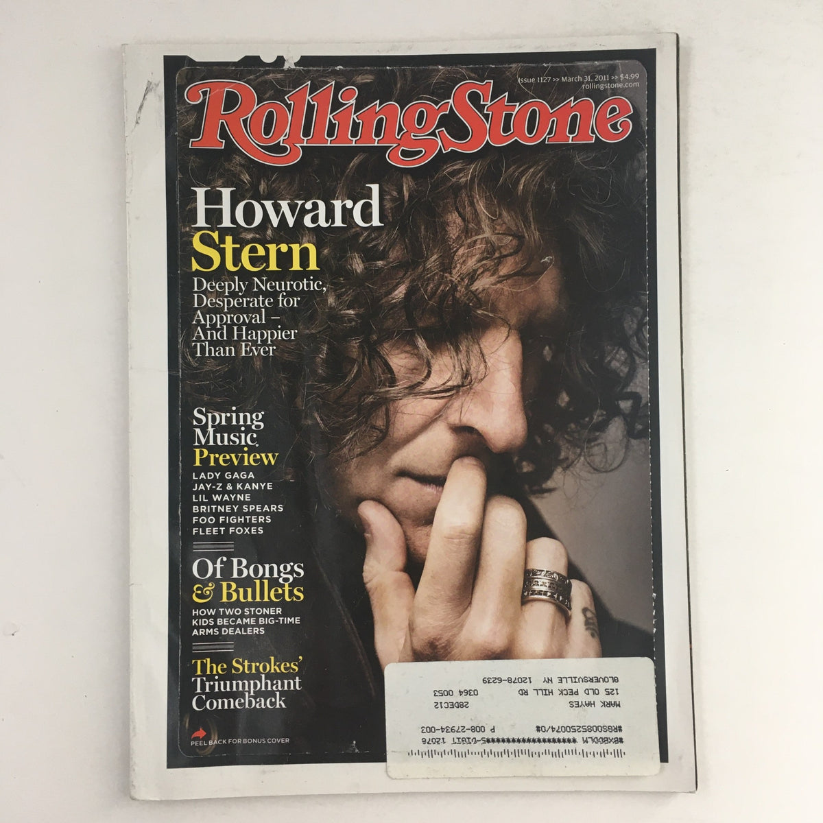 Cover of Rolling Stone Magazine from March 31, 2011 featuring Howard Stern, showcasing his conflicted expression and iconic hairstyle, highlighting this issue's focus on music and pop culture.