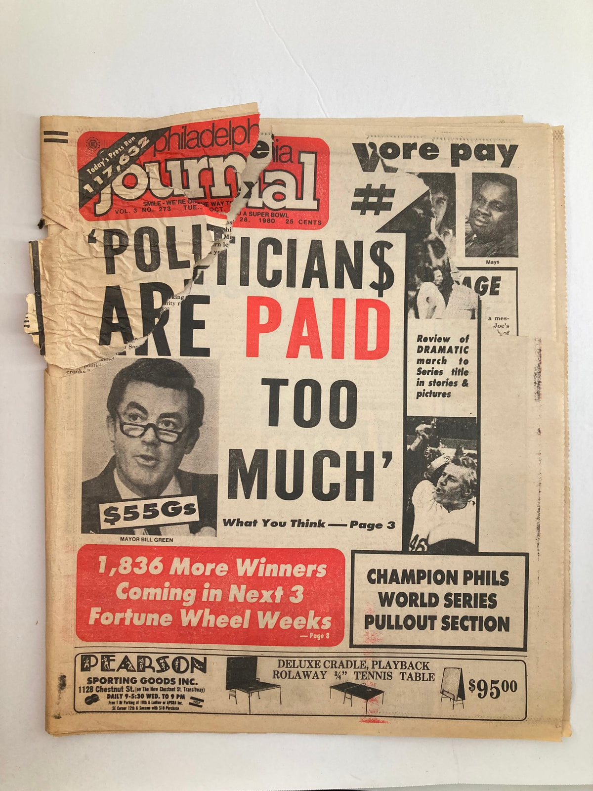 Philadelphia Journal Tabloid from October 28, 1980, showcasing the headline 'POLITICIANS ARE PAID TOO MUCH' alongside an image of Mayor Bill Green, featuring significant wear and tear and a torn cover.