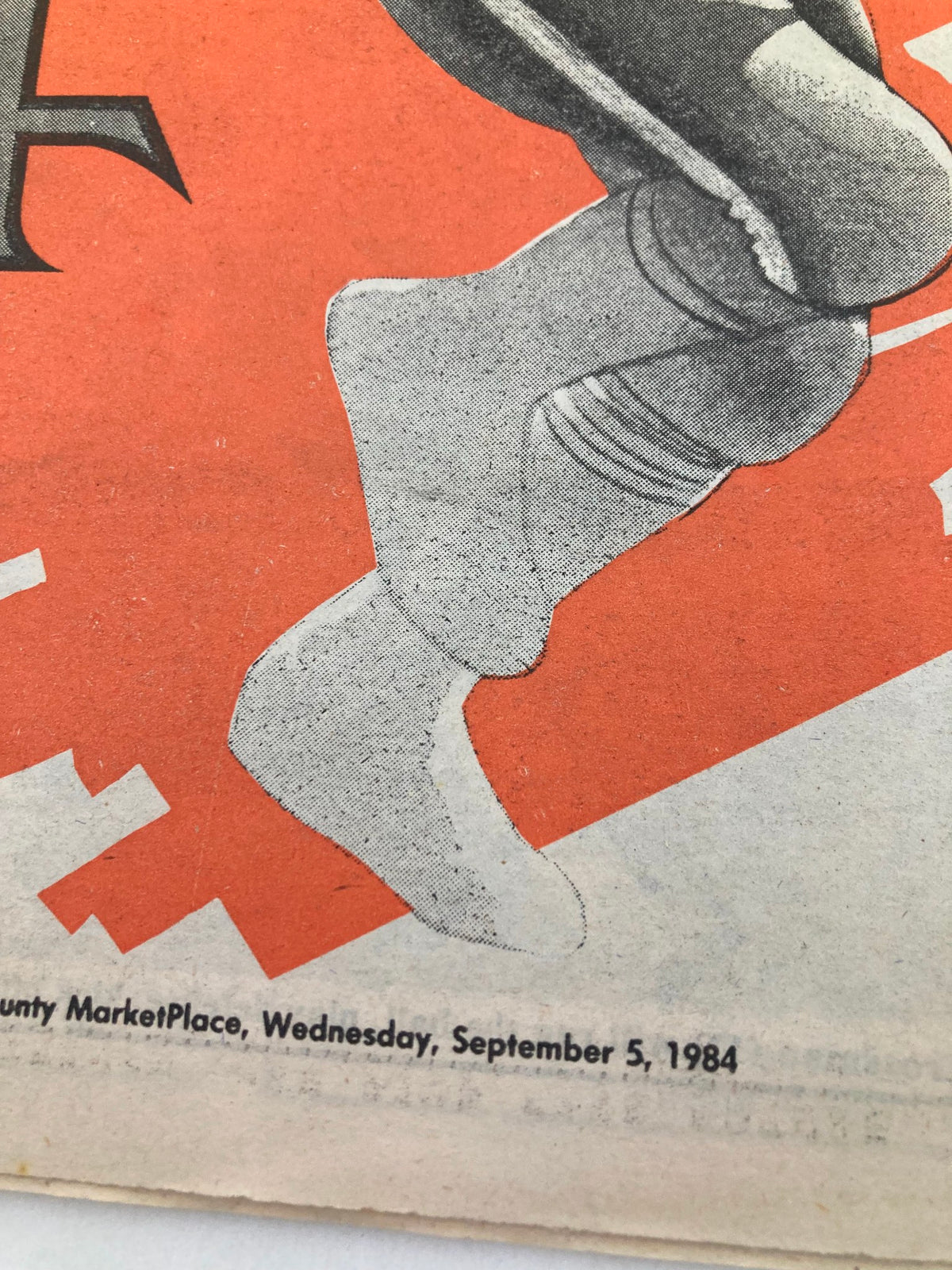 Close-up showing the foot of a football player in the supplement to the Mercury September 5 1984 NFL Football '84 Season highlighting the date of publication.