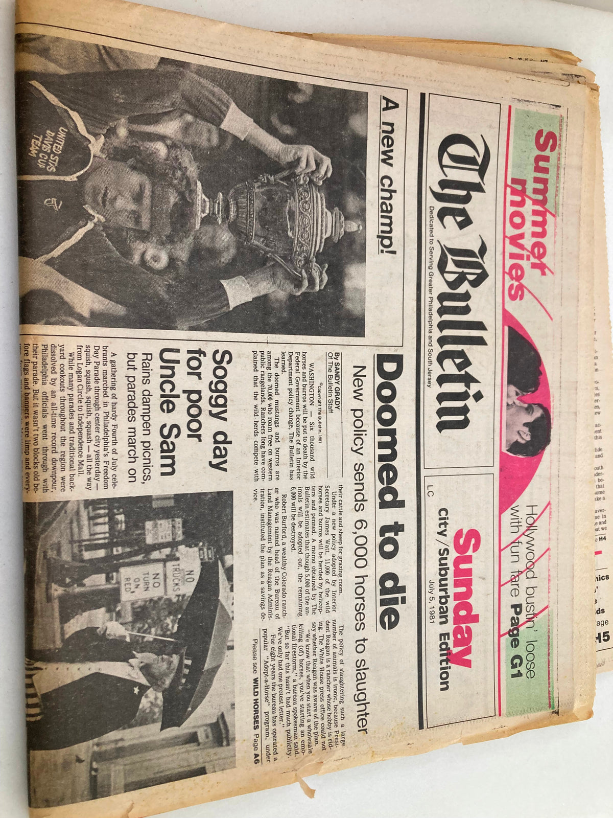 The Bulletin Newspaper July 5 1981 John McEnroe Carries Men's Single Trophy. Close-up view of John McEnroe proudly displaying the men's singles trophy on the front page, accompanied by news of a soggy day and political discussions.