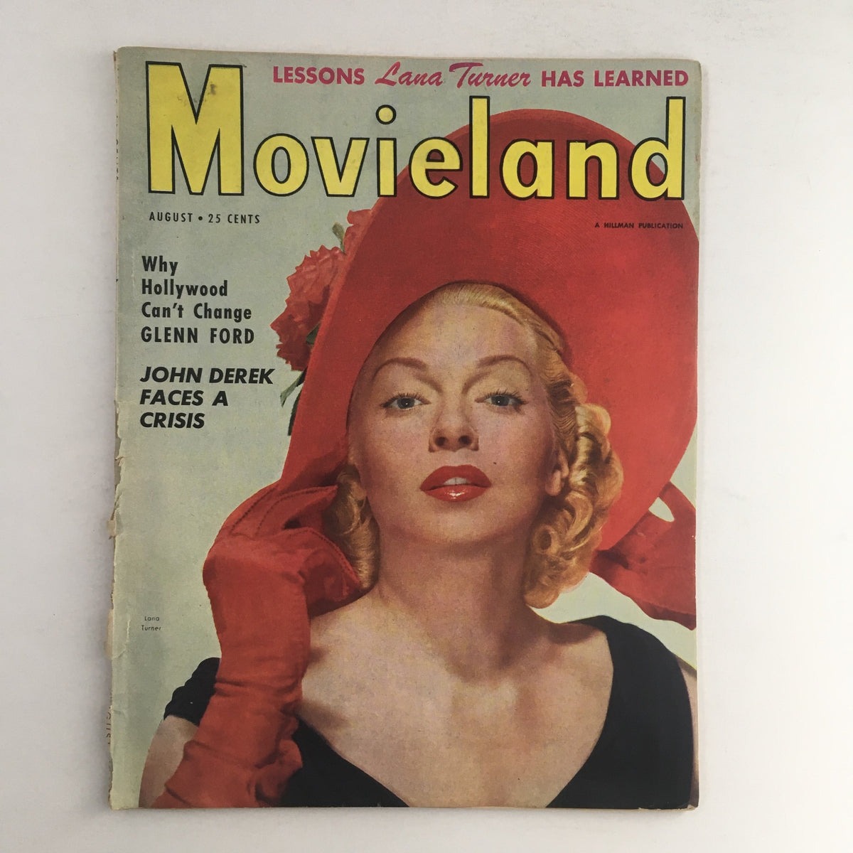 Cover of VTG Movieland August 1951 featuring Lana Turner in a stylish red hat and gloves, with the title prominently displayed and mentioning Glenn Ford and John Derek.
