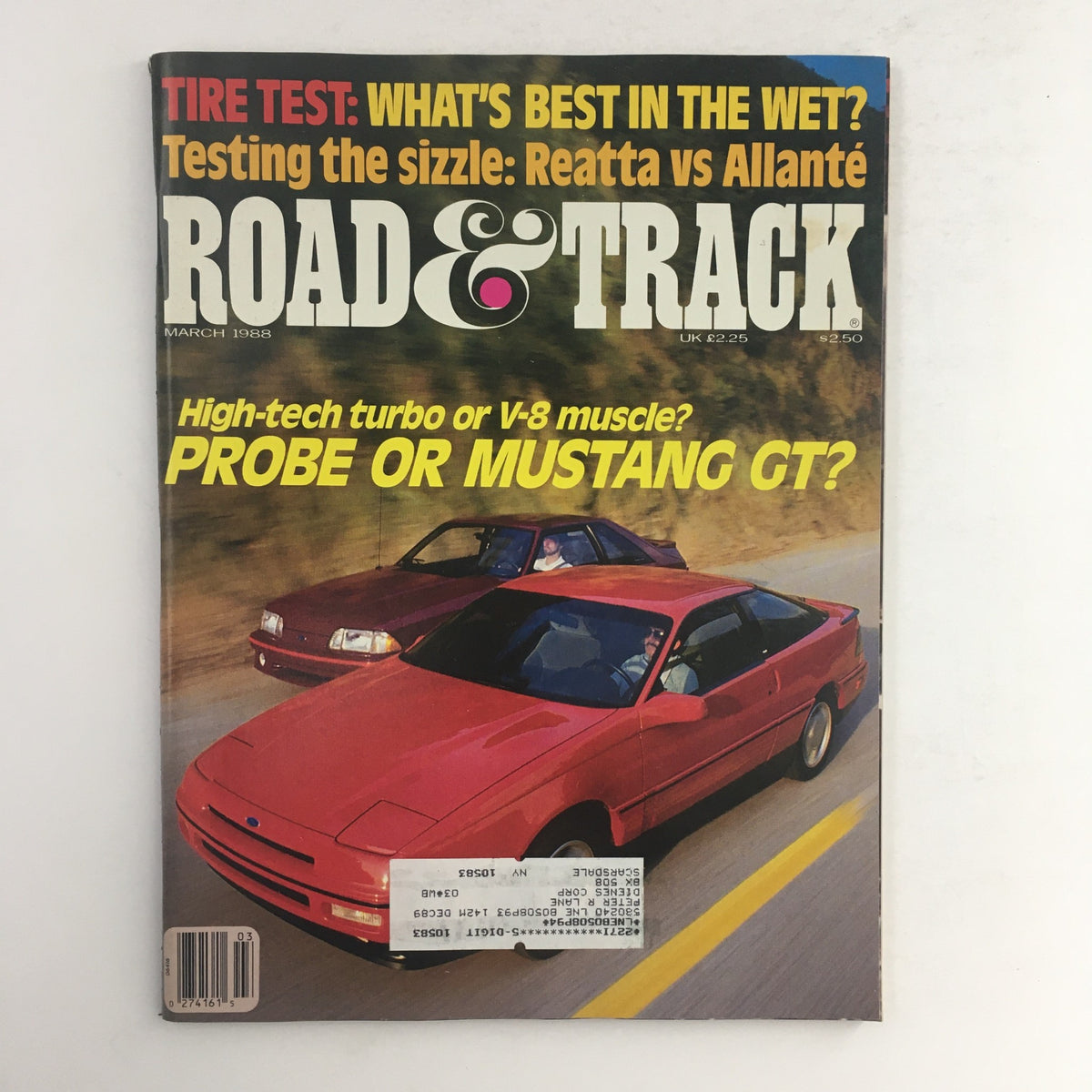 Cover of Road & Track Magazine March 1988 featuring the title 'Mustang GT High-Tech Turbo or V-8 Muscle?'. The cover showcases a red Ford Mustang GT and another vehicle on a scenic road, capturing the excitement of automotive technology and muscle cars in the late '80s.