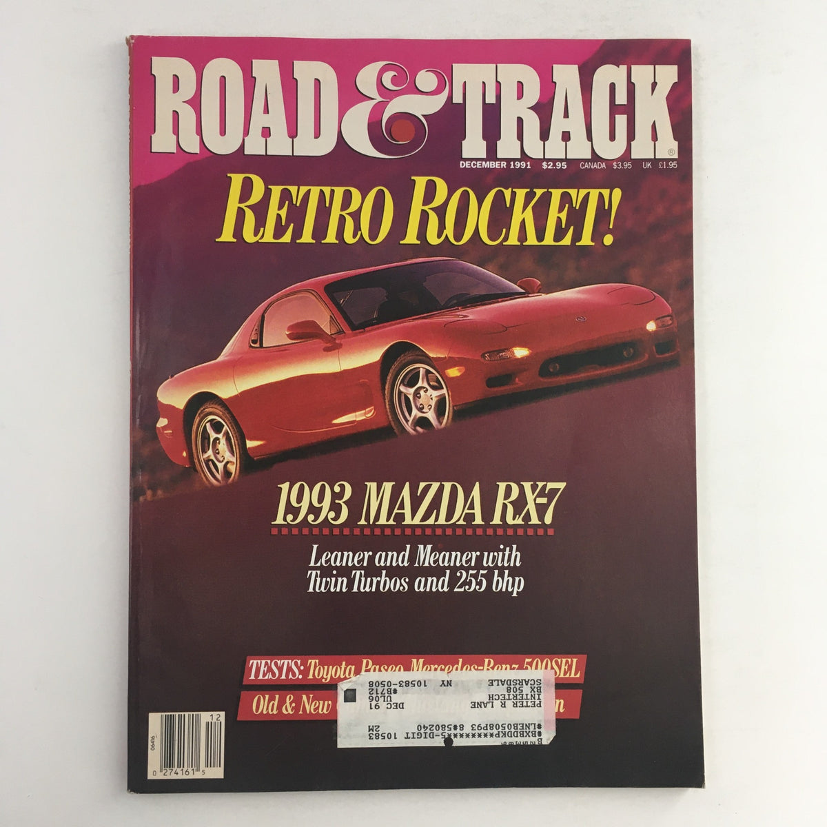 Road & Track Magazine December 1991 featuring the 1993 Mazda RX-7 Twin Turbos on the cover, showcasing the sports car's sleek design and highlighting its performance with twin turbos and 255 bhp.
