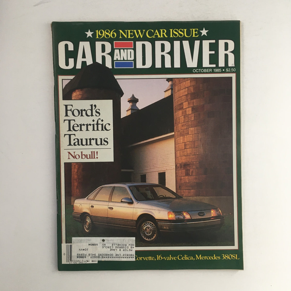 Cover of Car & Driver Magazine, October 1985 issue featuring Ford's Terrific Taurus and Mercedes 380SL, showcasing a silver Ford Taurus parked in front of a barn-like building.