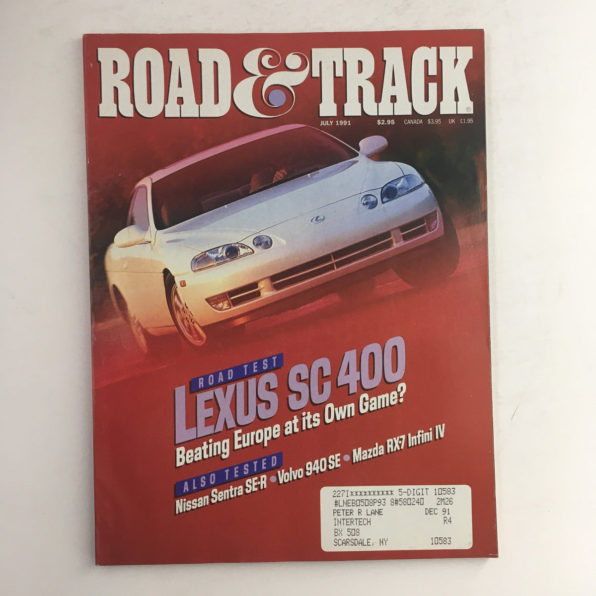 Road & Track Magazine July 1981 featuring road tests of Lexus SC 400 and Nissan Sentra SE-R, showcasing vintage automotive culture and performance insights.