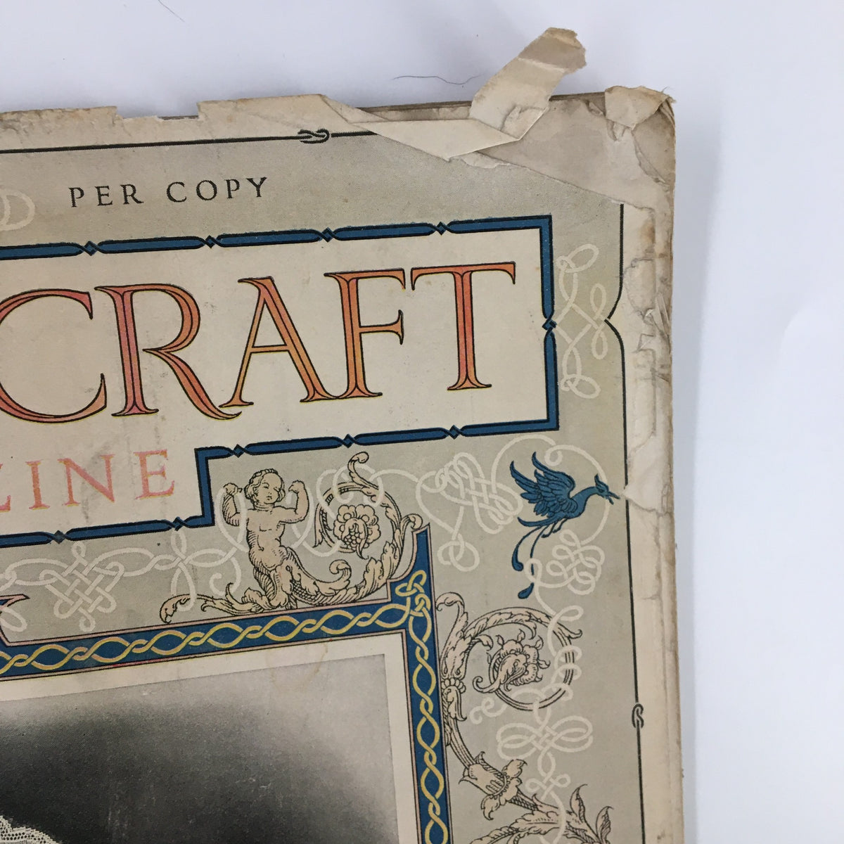 Close-up of the top corner of the VTG Needlecraft Magazine February 1927 cover, highlighting the title and decorative details.