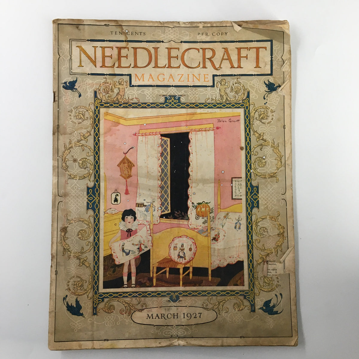 Cover of VTG Needlecraft Magazine, March 1927, showcasing vintage needlework, featuring artwork of a young girl in a cozy sewing room with colorful decorations.