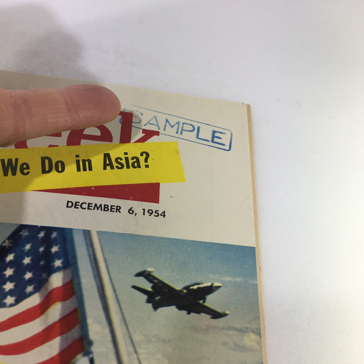 Close-up view of the VTG Newsweek Magazine December 6 1954 with a highlighted text 'What Do We Do in Asia?' and a 'SAMPLE' stamp.