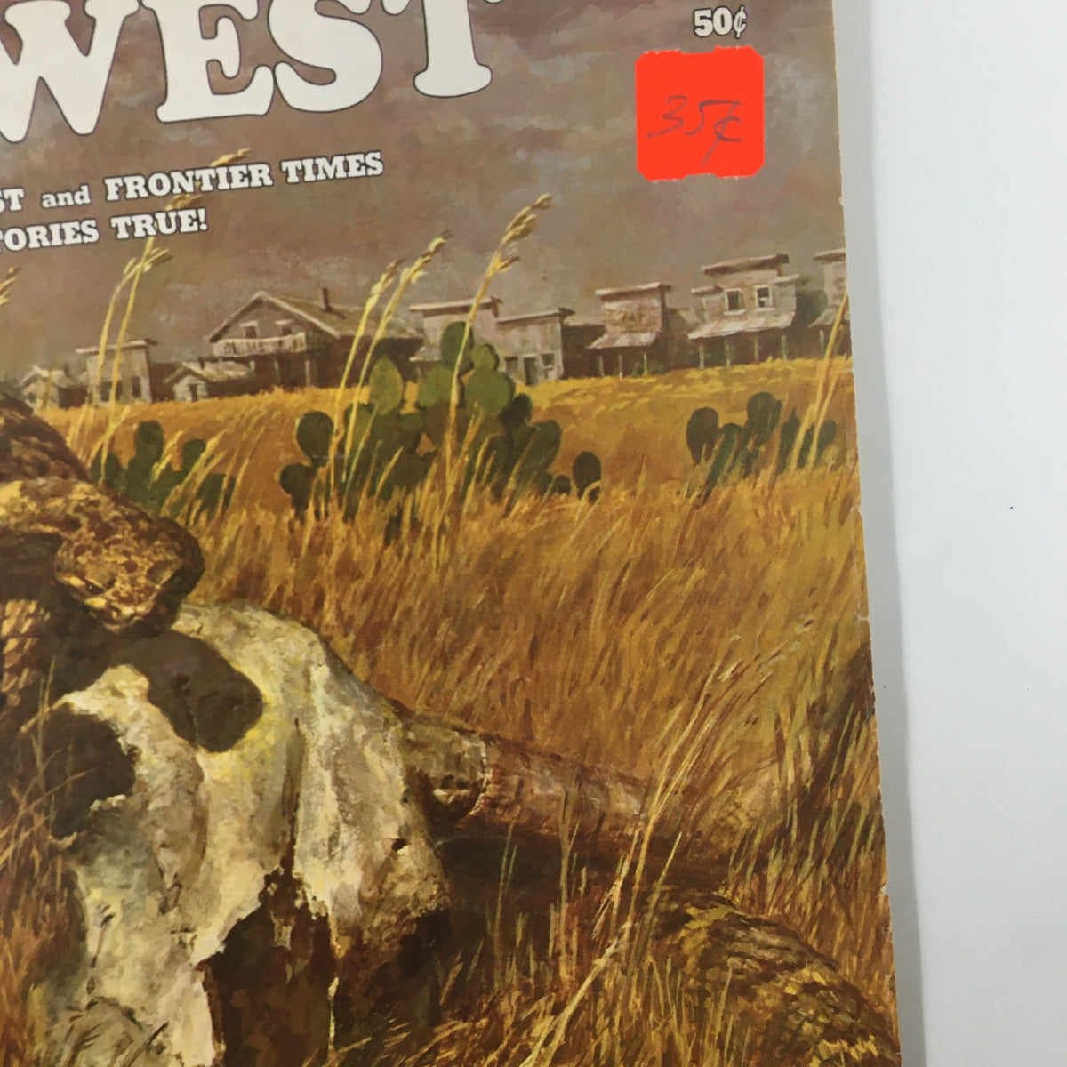 Close-up view of the VTG Old West Magazine Winter 1965 cover featuring a rattlesnake and historical scenery, with a visible price sticker.